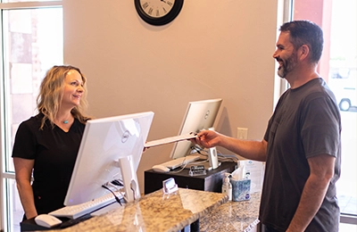 Chiropractic St. George UT Staff Member Greeting Patient