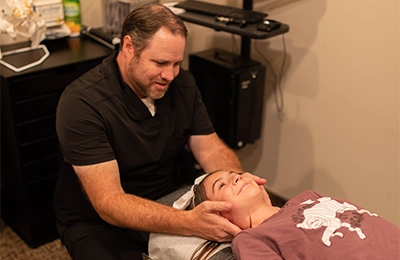 Chiropractor St. George UT Corey Wilhelmsen Adjusting Patient
